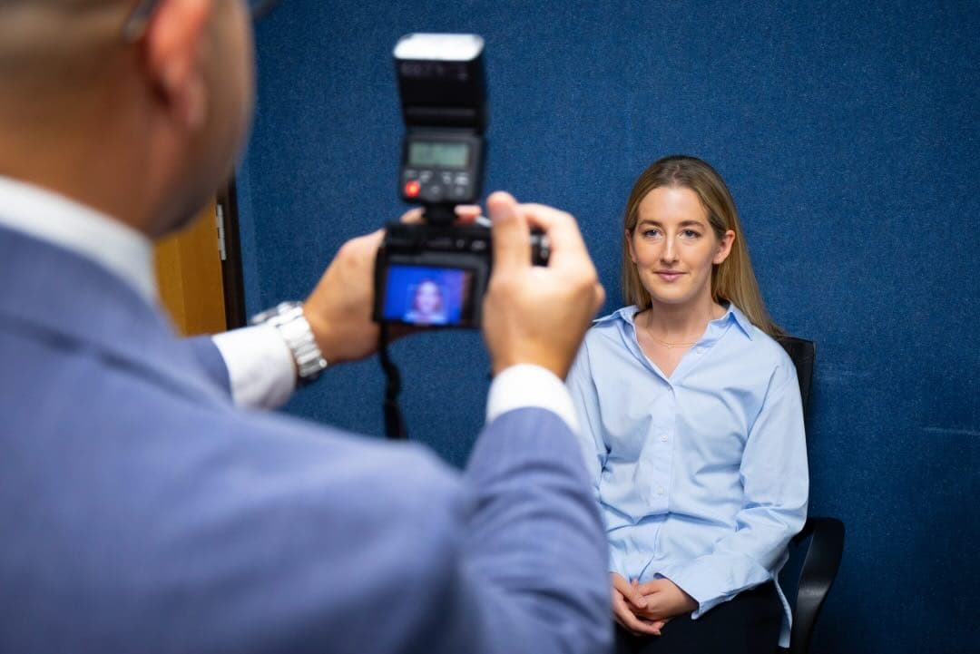 Mr Anwar photographing a patient during a consultation